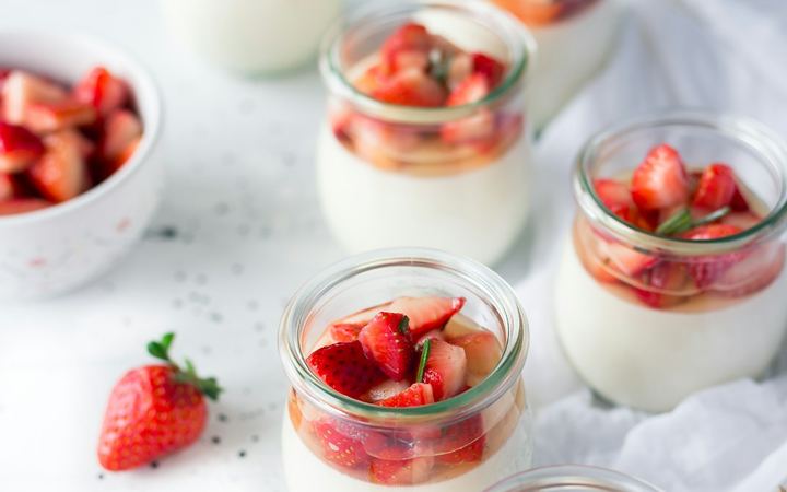 Yogurt jars topped with strawberries
